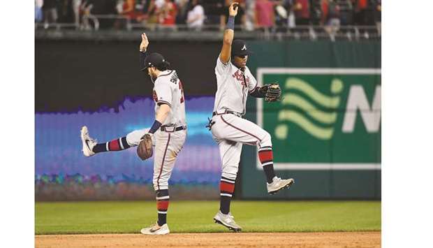 Atlanta Braves shortstop Dansby Swanson (left) and centre fielder Ronald Acuna Jr celebrate their win over Washington Nationals at Nationals Park. PICTURE: USA TODAY Sports