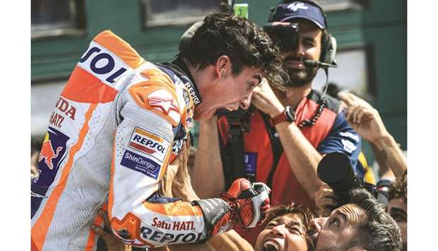 Hondau2019s Spanish rider Marc Marquez celebrates after winning the San Marino MotoGP at the Misano World Circuit Marco Simoncelli yesterday. (AFP)