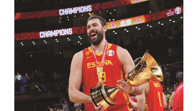 Spainu2019s Marc Gasol celebrates with the trophy after winning the FIBA World Cup in Beijing yesterday.