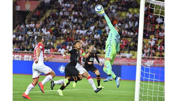 Monacou2019s goalkeepper Benjamin Lecomte makes a save during the French Ligue 1 match against Marseille at Louis II stadium in Monaco on Sunday night. (AFP)