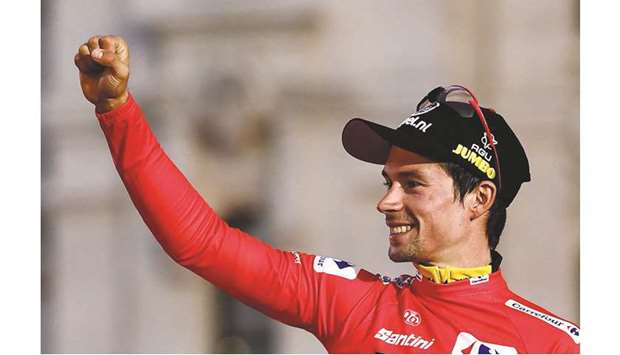 Primoz Roglic celebrates on the podium after winning the La Vuelta cycling Tour of Spain on Sunday. (AFP)