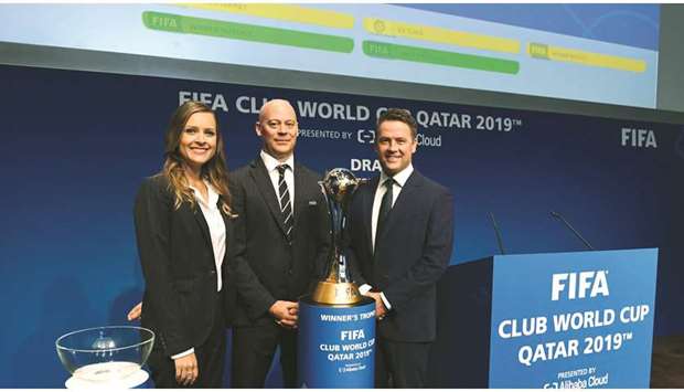 Former England and Liverpool player Michael Owen (left) poses with Club World Cup trophy in Zurich yesterday. PICTURES: FIFA