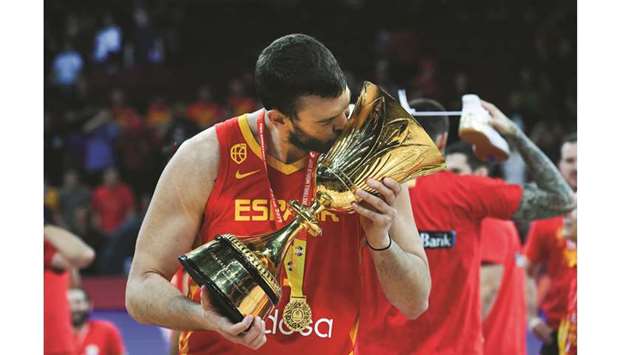 Spainu2019s Marc Gasol celebrates with their winning trophy at the end of the Basketball World Cup final against Argentina in Beijing on Sunday. (AFP)