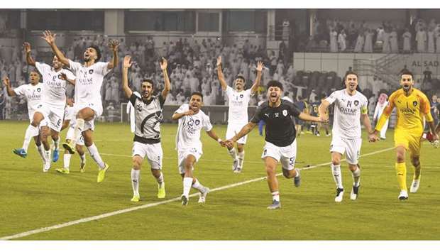 Al Sadd players celebrate their win over Al Nassr yesterday. PICTURES: Noushad Thekkayil and agencies