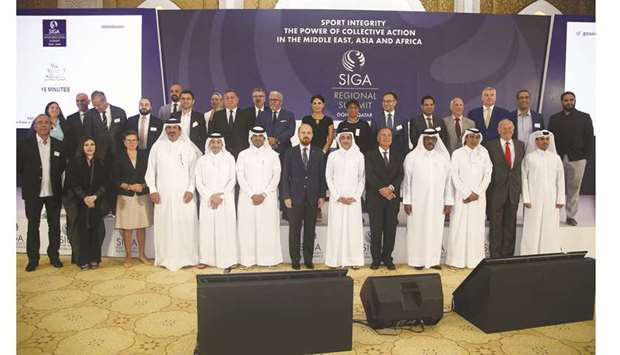 Qatari officials and international delegates pose with HE Salah bin Ghanem bin Nasser al-Ali, Minister of Culture and Sports (sixth from right, front row) during the opening day of the SIGA Inter-Regional Summit. Dahlan al-Hamad is fourth from right.