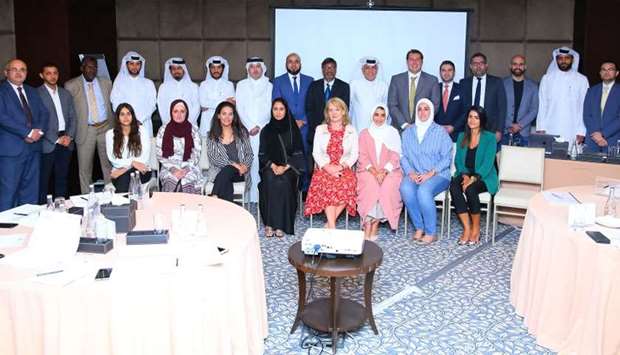 Representatives of listed companies with officials of the QSE at the IR training programme