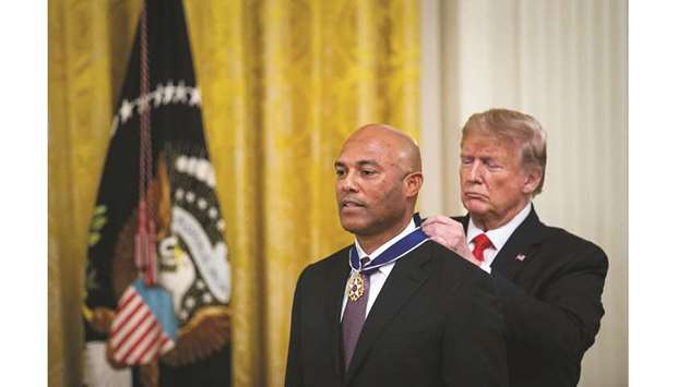 US President Donald Trump presents the Medal of Freedom to former New York Yankees pitcher Mariano Rivera in Washington. (Reuters)