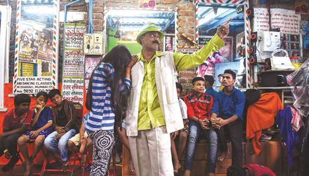 Baburao Ladsaheb performs for his students during a class at the Five Star Acting Dancing Fighting Classes in Dharavi.