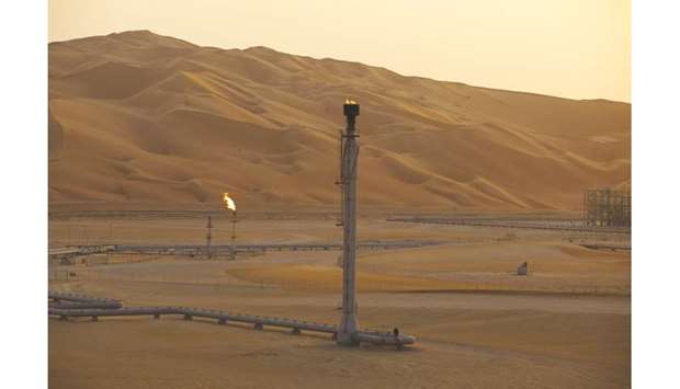 Flames burn off at an oil processing facility in Saudi Aramcou2019s oilfield in the Rubu2019 Al-Khali (Empty Quarter) desert in Shaybah (file). The oil and gas sector accounts for about 50% of Saudi Arabiau2019s gross domestic product.