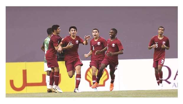 Qatar players celebrate scoring against Bangladesh at the Aspire Zone Indoor Stadium yesterday.