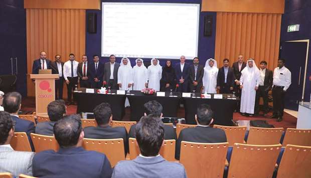 Ooredoo and Gulf Exchange officials during the partnership announcement.