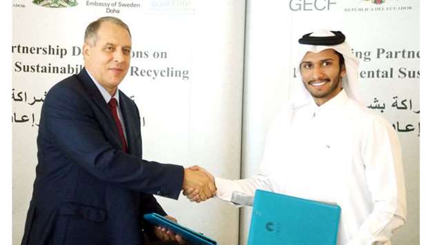Dr Yury Sentyurin (left) and Abdallah al-Suwaidi at the signing ceremony in Doha for environmental sustainability. PICTURE: Jayan Orma