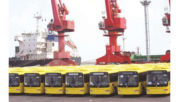Buses wait to be exported in Lianyungang port. Economists believe Chinau2019s economic growth likely cooled further this quarter from a near 30-year low of 6.2% in April-June, but they differ on whether the slowing trend could persist despite a raft of government policy measures.
