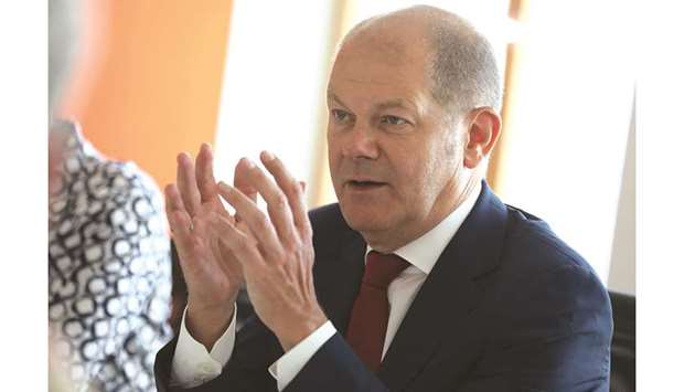 Olaf Scholz, Germanyu2019s finance minister, gestures while speaking during an interview in Berlin. Scholz has pointed toward a potential u20ac50bn ($55bn) of stimulus, but only in the event of an economic crisis. At the moment, the euro areau2019s biggest economy is still committed to its so-called debt brake.