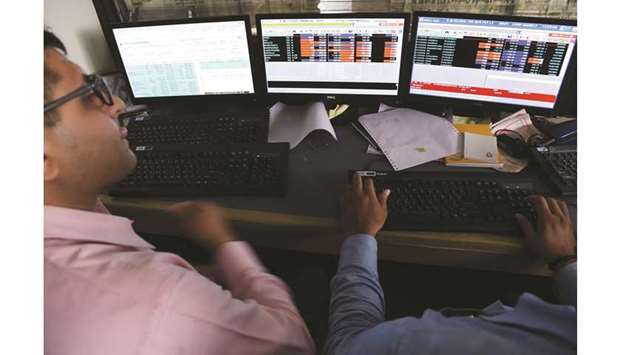 Traders monitor share prices at the Bombay Stock Exchange. The Sensex declined 1.3% to 36,093.47 points at the 3:30pm close in Mumbai yesterday.