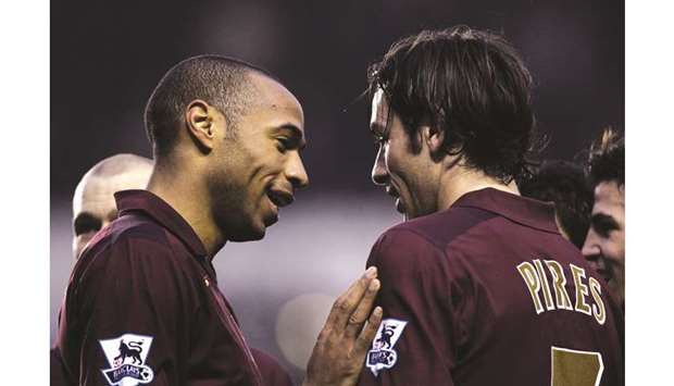 In this January 14, 2006, picture, Arsenalu2019s Robert Pires celebrates scoring a goal with teammate Thierry Henry during the Premiership match against Middlesbrough. (Reuters)