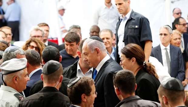Israeli Prime Minister Benjamin Netanyahu arrives to a memorial ceremony for late Israeli President Shimon Peres, at Mount Herzl in Jerusalem yesterday.
