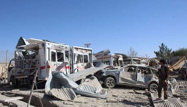 Afghan security forces investigate the site where a car bomb detonated near an intelligence services building in Qalat in Zabul province