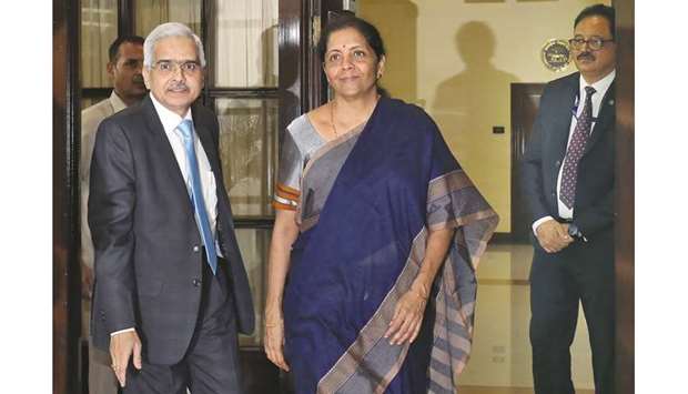 Indiau2019s finance minister Nirmala Sitharaman and the Reserve Bank of India governor Shaktikanta Das arrive to attend the RBIu2019s central board meeting in New Delhi (file). Sitharaman said the effective corporate tax rate in India would be lowered to around 25% from 30%, which she said would put it on a par with Asian peers.
