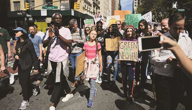 Thunberg is seen with others during the Global Climate Strike march in New York City.