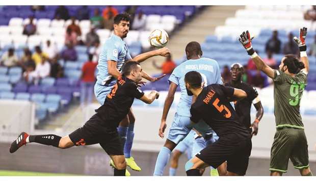 The Umm Salal defence try to deal with Al Saddu2019s Baghdad Bounedjah and Abdelkarim Hassan during their QNB Stars League match. PICTURE: Jayan Orma
