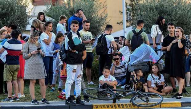 Residents gather outdoors in Tirana after two earthquakes above 5.0 magnitude struck the coastline Adriatic coastline of Albania