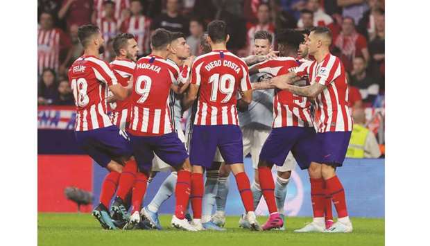 Atletico Madrid and Celta Vigo players clash during the La Liga match in Madrid yesterday. (Reuters)