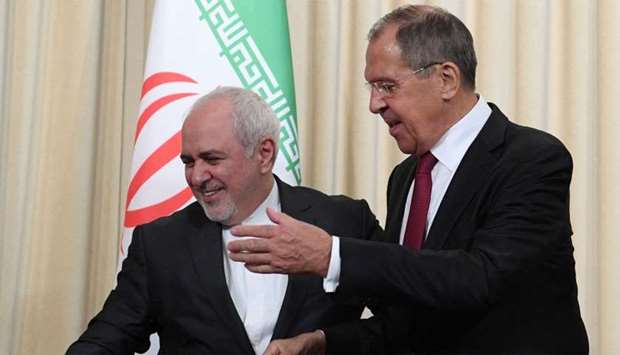 Russian Foreign Minister Sergei Lavrov (R) and his Iranian counterpart Mohammad Javad Zarif attend a meeting in Moscow