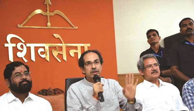 Shiv Sena chief Uddhav Thackeray addresses a press conference in Mumbai on Friday. He is flanked by party leaders Eknath Shinde and Anil Desai.