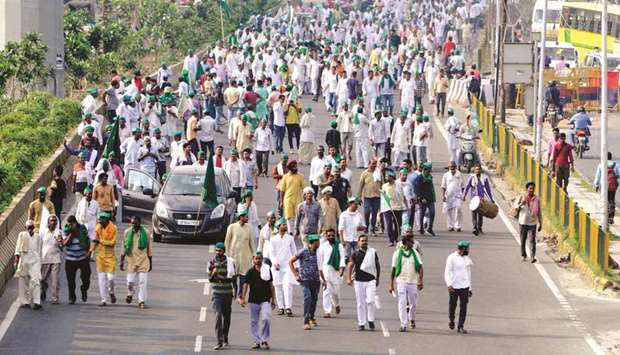 Hundreds of farmers march from Noida to New Delhiu2019s Kisan Ghat to demand among other things full loan waivers, higher rate for sugarcane crops, revised power tariff in Uttar Pradesh, in Ghaziabad yesterday.