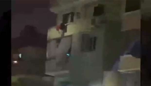 An image grab from a video posted on social media that shows the building where terrorists were hiding