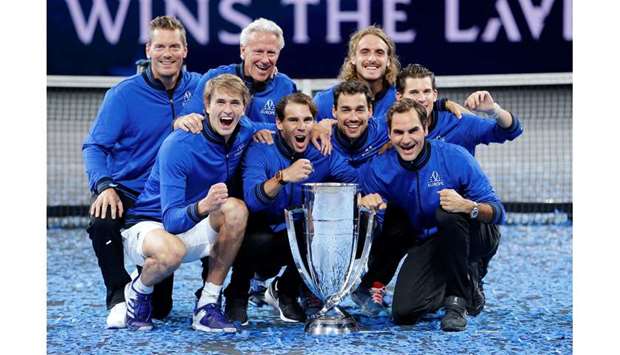 Team Europe captain Bjorn Borg, vice-captain Thomas Enqvist, Alexander Zverev, Dominic Thiem, Fabio Fognini, Stefanos Tsitsipas, Roger Federer and Rafael Nadal pose with the trophy after they win the Laver Cup in Geneva yesterday. (Reuters)