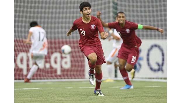 Qatar players celebrate after their win over Bhutan in the Asian U-16 Championship Qualifiers at the Aspire Dome pitch yesterday.