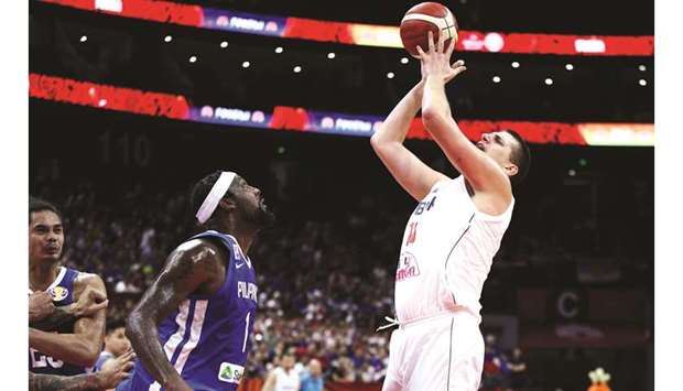Nikola Jokic (right) of Serbia in action with Andray Blatche of Philippines during the FIBA Basketball World Cup first round match at Foshan International Sports & Cultural Arena in China yesterday. (Reuters)