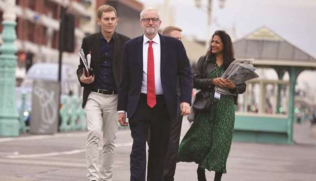Labour leader Jeremy Corbyn arrives for an interview with the BBC during the Labour party conference in Brighton, on the south coast of England, yesterday.