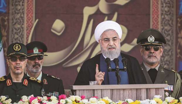 A handout picture provided by the Iranian presidency yesterday shows President Hassan Rouhani giving a speech during the annual u201cSacred Defence Weeku201d military parade marking the anniversary of the outbreak of the devastating 1980-1988 war with Iraq, in Tehran.