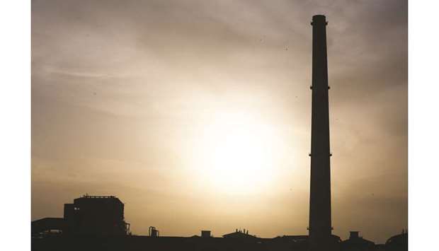 A smokestack of the shut coal-fired NTPC Ltd Badarpur Thermal Power Station stands in Badarpur, New Delhi (file). Asiau2019s prolonged binge on coal is making the grids that transmit power to a third of the worldu2019s people brittle and prone to failure.