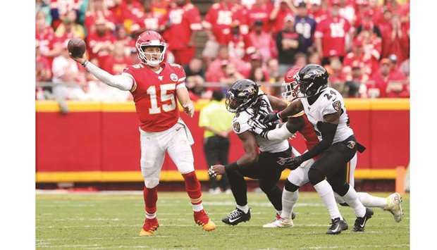 Kansas City Chiefs quarterback Patrick Mahomes throws a pass as Baltimore Ravens linebacker Tim Williams and cornerback Brandon Carr defend during the second half at the Arrowhead Stadium. PICTURE: USA TODAY Sports
