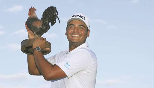 Sebastian Munoz of Colombia poses with the trophy after putting in to win in a sudden death playoff during the final round of the Sanderson Farms Championship at The Country Club of Jackson in Jackson, Mississippi. (Getty Images/AFP)