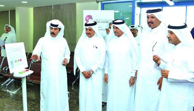 Qatar Chamber second vice chairman Rashid bin Hamad al-Athba launching the new system in the presence of Qatar Chamber chairman Sheikh Khalifa bin Jassim al-Thani, first vice chairman Mohamed bin Towar al-Kuwari, and other board members.