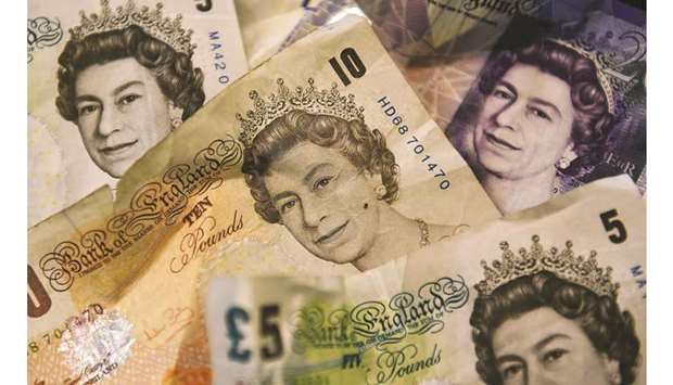 A close-up of a mixture of British pound notes is seen in London (file). The pound rallied against both the dollar and the euro yesterday as traders mulled the chance that Britain could now more easily avoid a no-deal departure from the European Union on October 31.