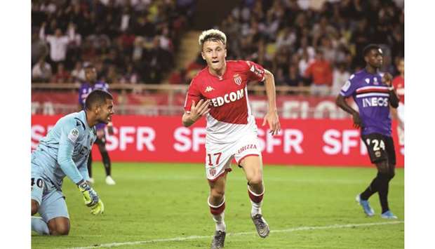 Monacou2019s Russian midfielder Aleksandr Golovin celebrates after scoring against Nice during the French Ligue 1 match in Monaco on Tuesday night. (AFP)