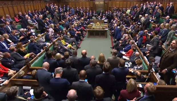 A video grab from footage broadcast by the UK Parliament's Parliamentary Recording Unit (PRU) shows a packed House of Commons in central London