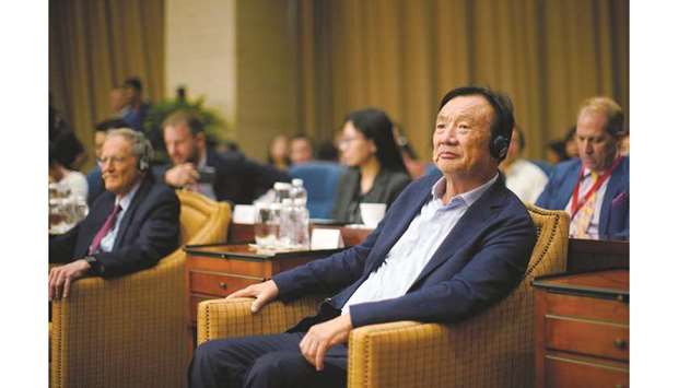 Huawei founder Ren Zhengfei attends a panel discussion at the company headquarters in Shenzhen, Guangdong province. Ren said the companyu2019s operations remained at full-throttle, but added u201cthere will be no huge increaseu201d in business next year.