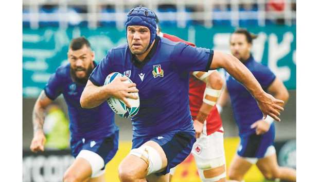 Italyu2019s lock Dean Budd runs in a try during their Pool B match at the Fukuoka  Hakatanomori Stadium in Fukuoka, Japan, yesterday. (AFP)