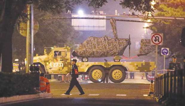 A military vehicle passes along a street in central Beijing.