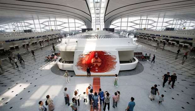 People are seen at the terminal hall of the newly launched Daxing International Airport on the outskirts of Beijing