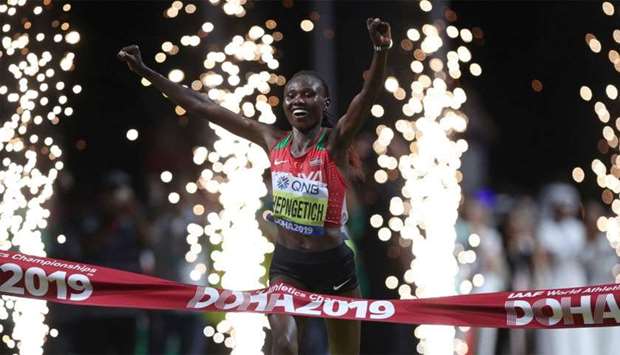 Kenya's Ruth Chepngetich crosses the line to win the race