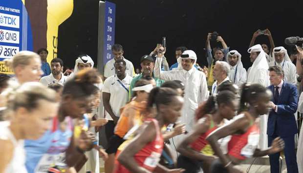 His Highness the Amir Sheikh Tamim bin Hamad al-Thani gets the race underway as HE the President of Qatar Olympic Committee (QOC), Sheikh Joaan bin Hamad al-Thani  and IAAF president Sebastian Coe look on