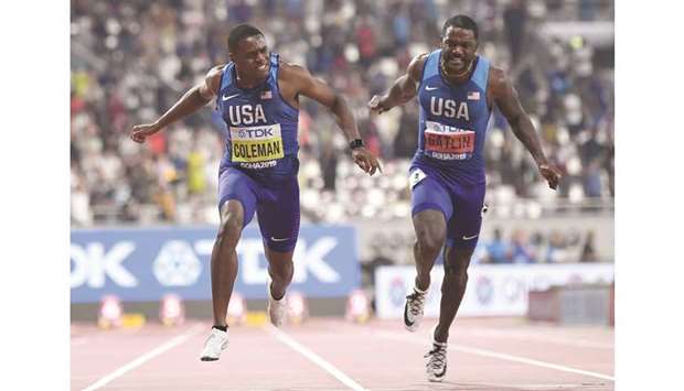USAu2019s Christian Coleman (L) crosses the finish line ahead of USAu2019s Justin  Gatlin to win the Menu2019s 100m final at the 2019 IAAF World Athletics Championships at the Khalifa International Stadium in Doha yesterday. At right, Coleman lets out a roar.